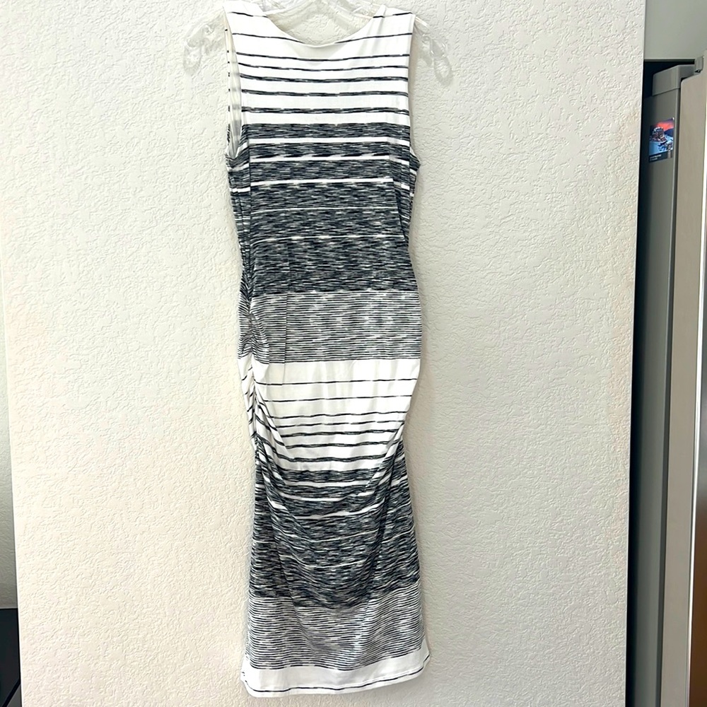 Athleta small body con dress.Black and white. Side ruching adds to the flatter!